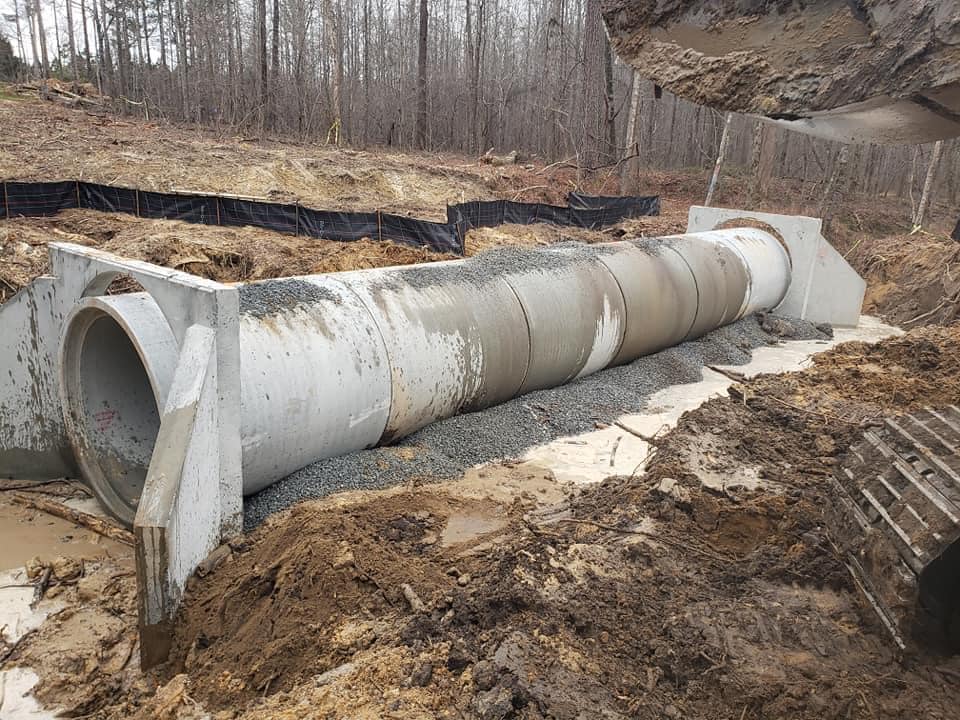 A sewer pipe at the middle of the forest